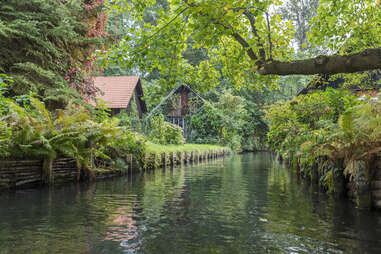 A tributary of the Spree river with small houses on the riverbanks