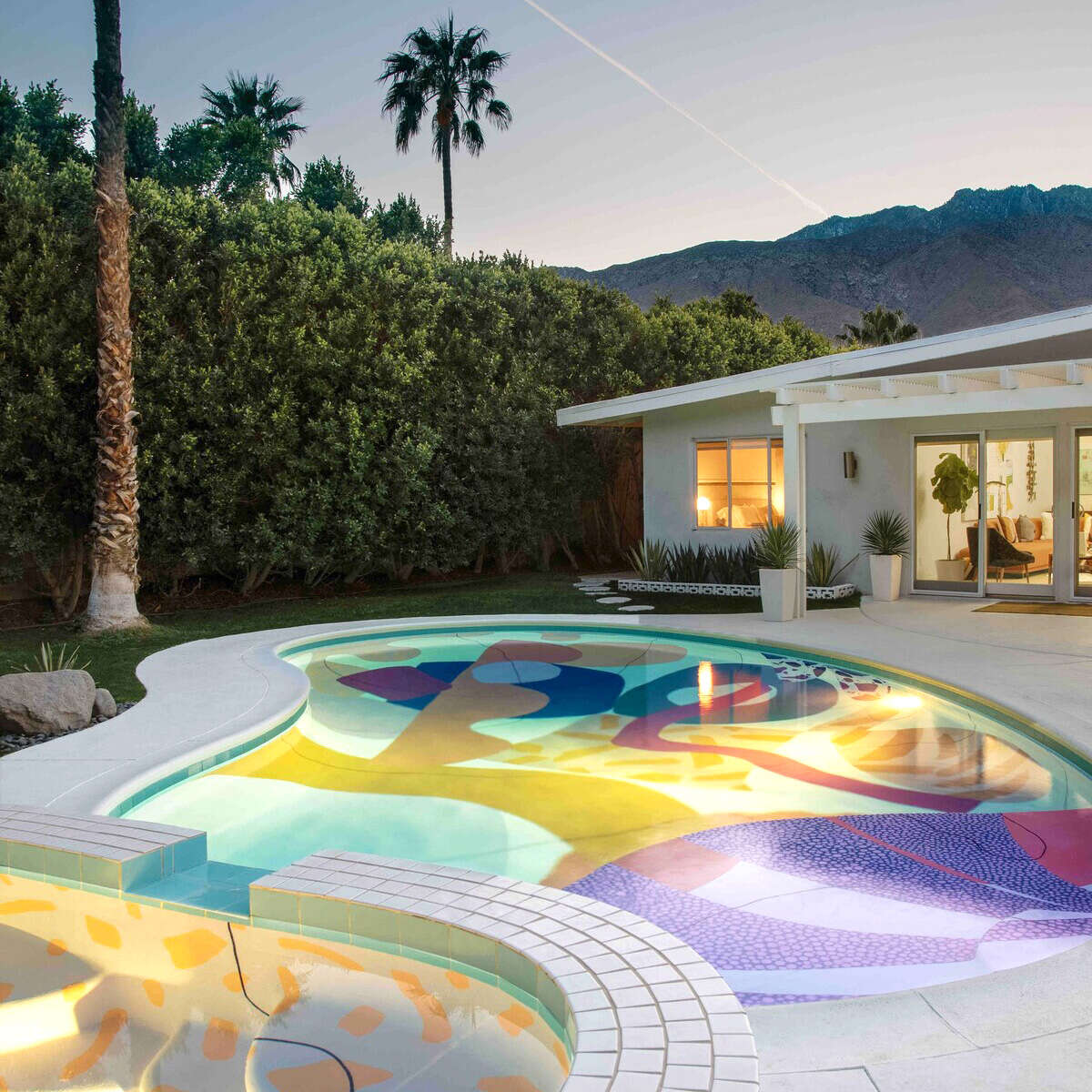 Mid-century modern house with colorful pool