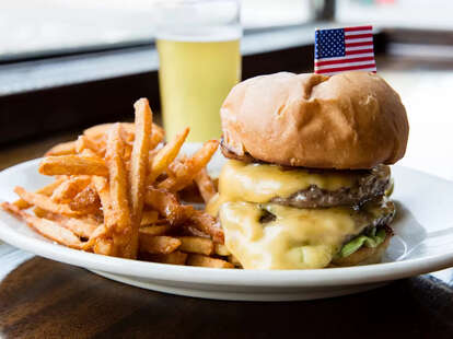 burger bacon cheese cheeseburger toppings pickles lettuce tomato guac avocado guacamole buns toasted egg yolk