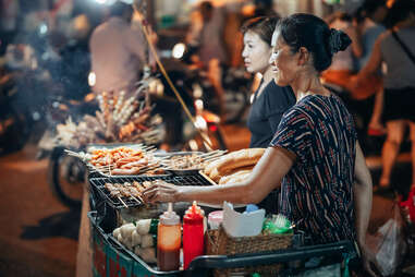 People eating at a market stall