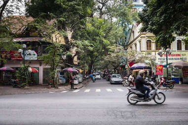 Traffic and businesses on a Hanoi street