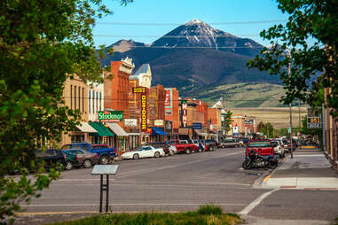 historic Old West style Main Street with mountains in the distance