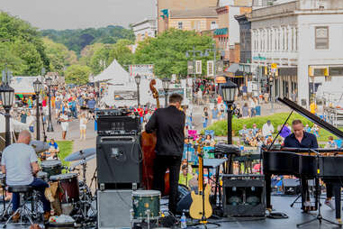 a band playing a concert during a busy city festival