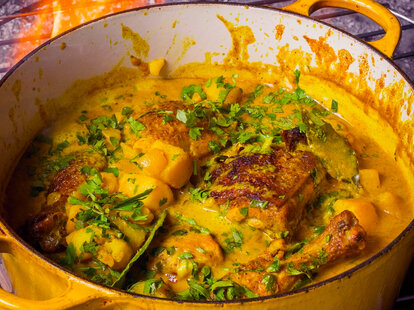curry chicken simmering in a pot