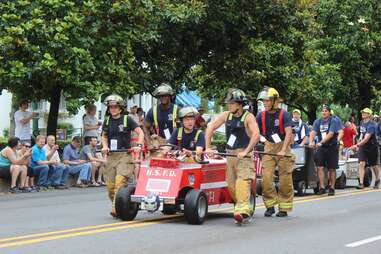 firefighters walking a parade in hot springs, arkansas