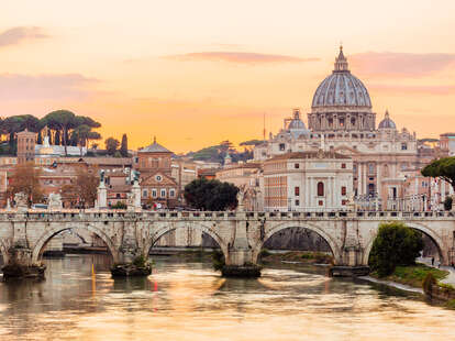 Rome skyline at sunset with Tiber river and St. Peter’s Basilica