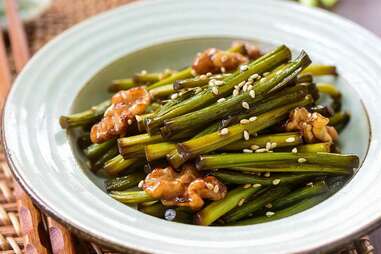 stir-fried garlic scapes with walnuts
