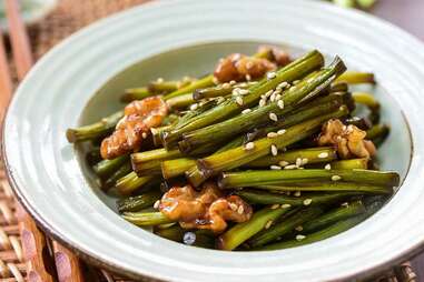 stir-fried garlic scapes with walnuts 