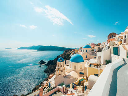 White buildings in side of mountain by the coast