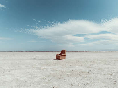 An armchair in the middle of Bombay beach