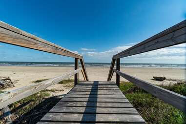 boardwalk leading to beach in freeport, texas