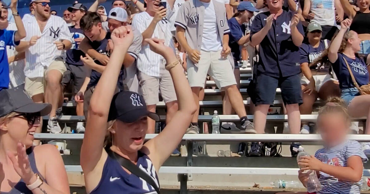 Watch Yankees fans go wild after little girl flips water bottle in