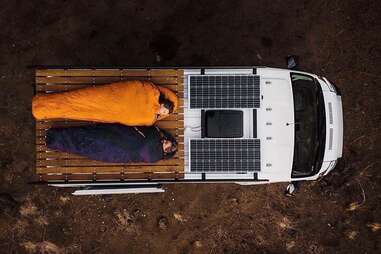 sleeping on top of a camper van