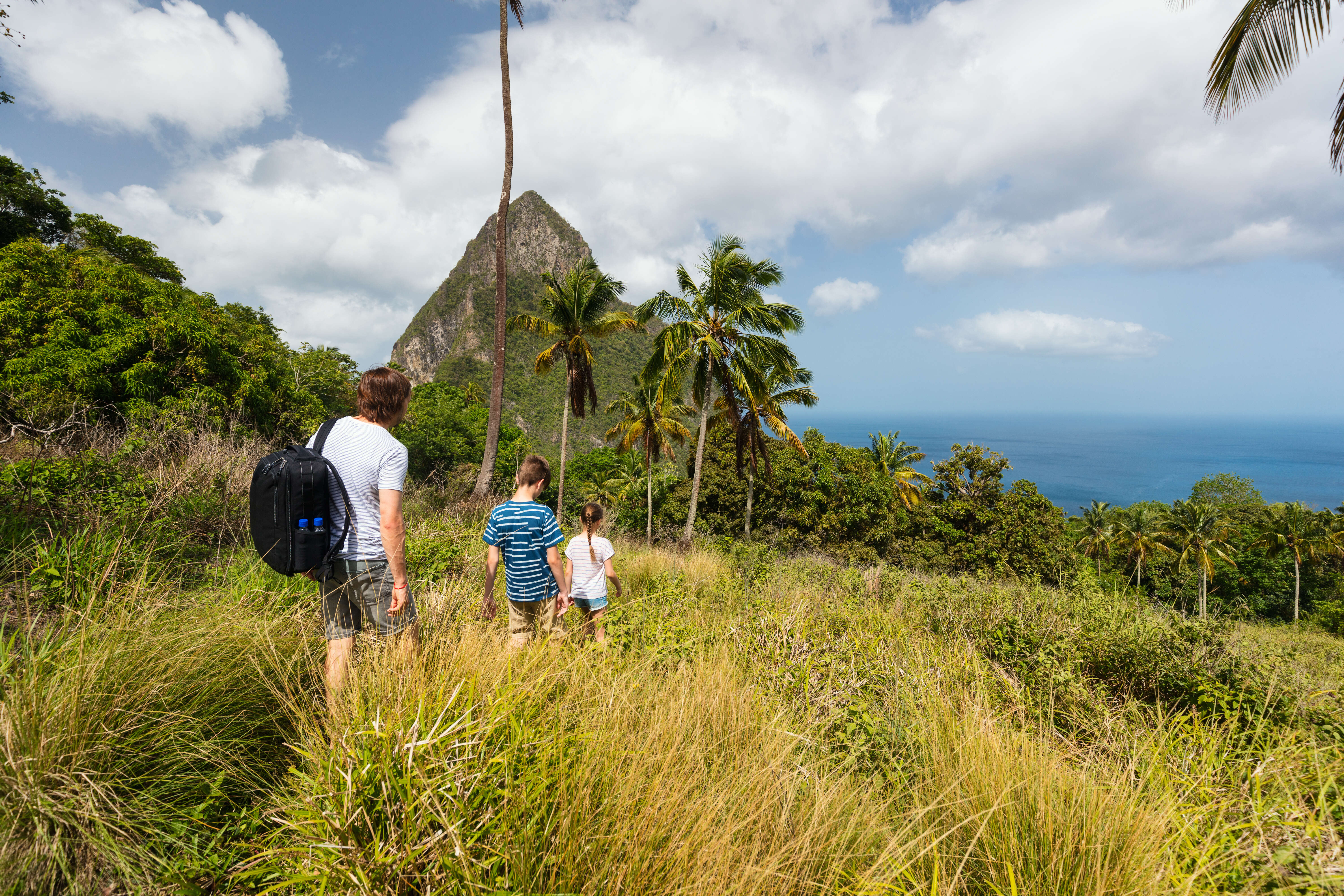 Family hiking in St Lucia with the Pitons in view