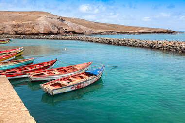 boats lined up at a harbor in cape verde