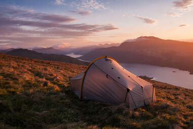 camping tent overlooking loch lomond at sunrise