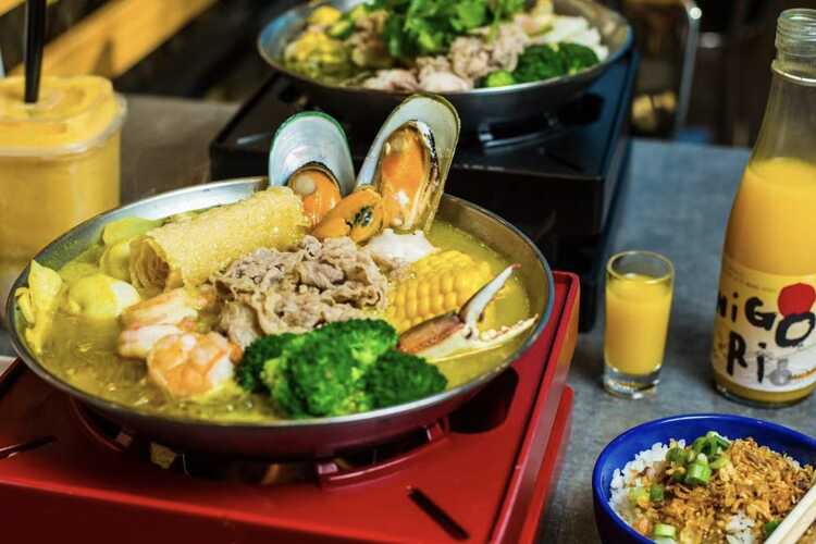 Dim Sum or Chinese dumpling in a stream hot pot of food wheelbarrow on  street food of Bangkok. Many dumpling in a wooden basket is streaming in  old As Stock Photo 