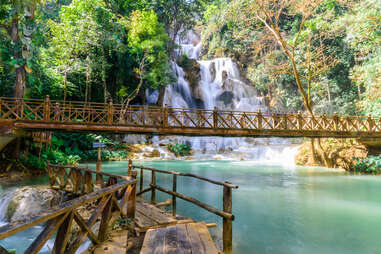 Kuang Si Waterfalls behind a bridge