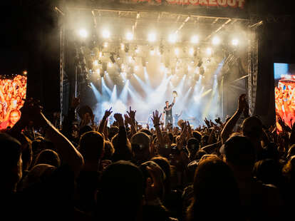 crowd cheering at a concert