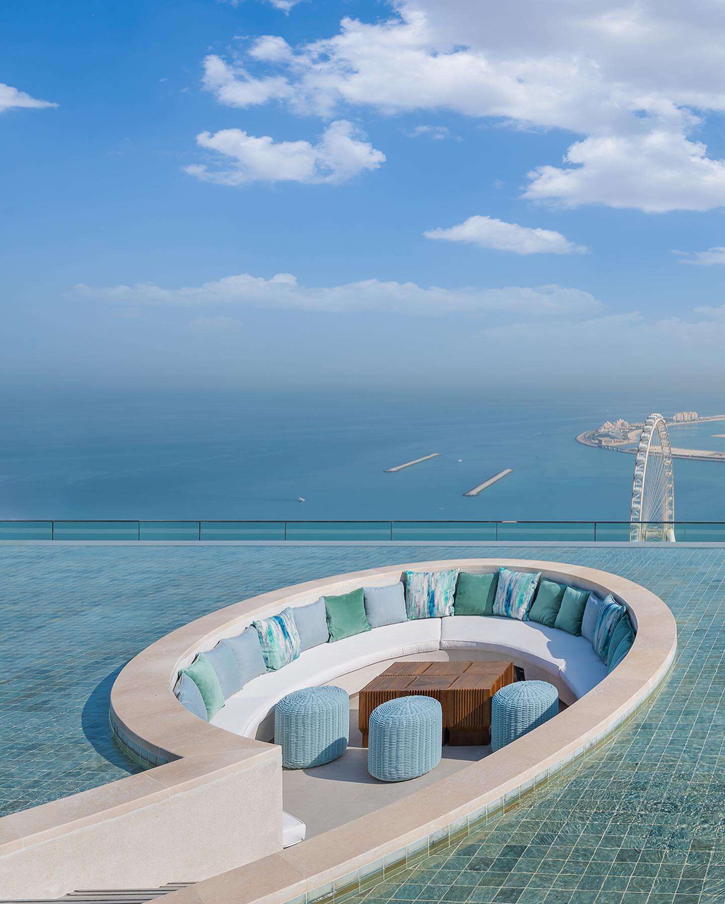 lounge area in the middle of a pool