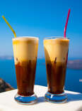 two glasses of espresso freddo overlooking sea