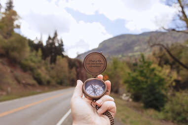 compass pointing towards road