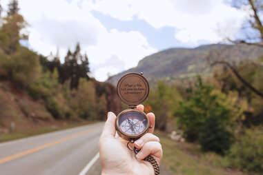 compass pointing towards road 
