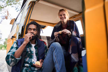 friends eating snacks in a car