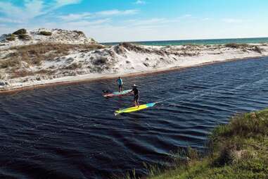 paddleboarding on river