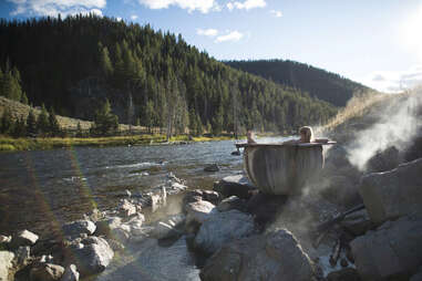 woman in hot springs near river