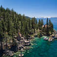 aerial view of rocky coast and cabins