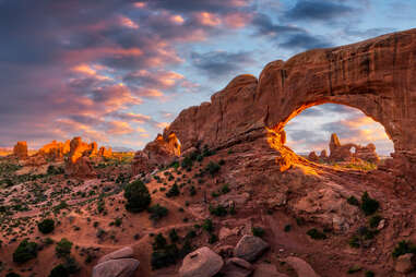 a giant sandstone arch in utah's high desert