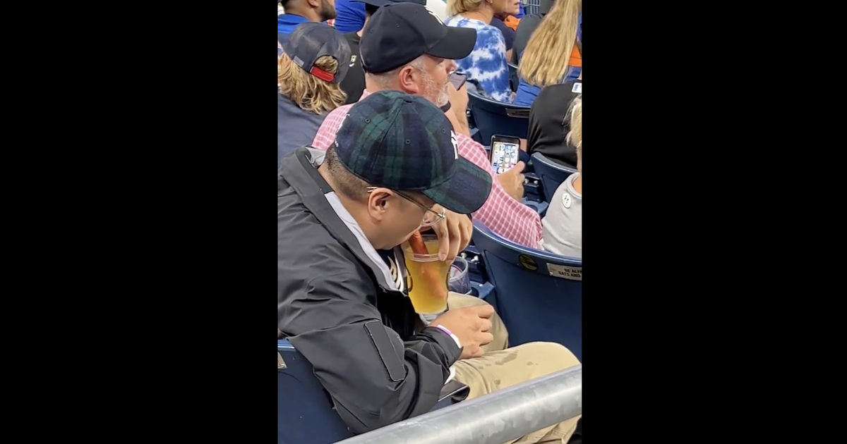 Watch vid of a Yankee fan drinking a beer w. a hot dog straw