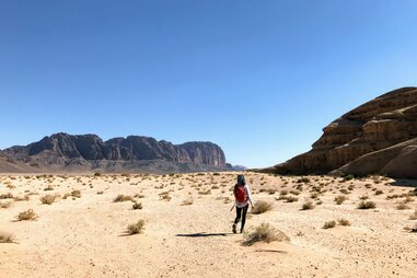 person walking in Jordan desert
