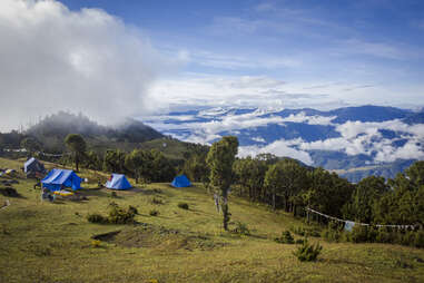 tents on a grassy hillside