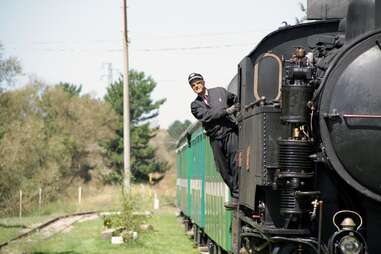 train conductor looking out of train