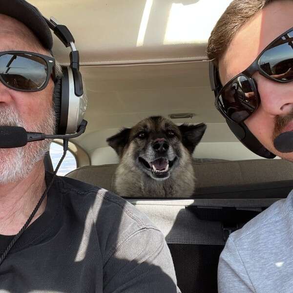 dog in plane with pilots