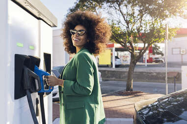 woman getting gas
