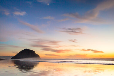 Morro bay rock and beach in the sunset evening