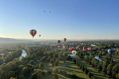 hot air balloons over city