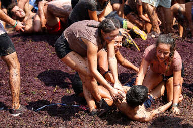 People take part in a grapes battle