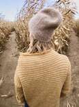woman in sweater in corn maze