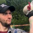 Man holding rooster