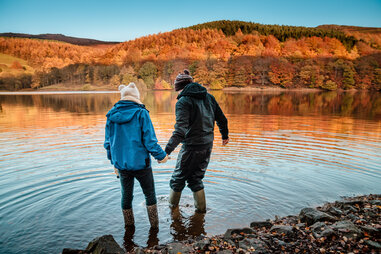 people standing in lake