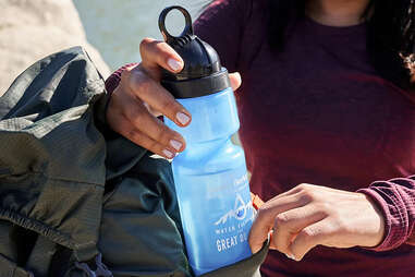 woman holding waterbottle