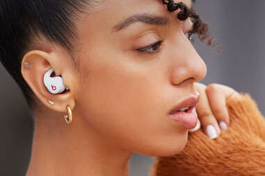 woman with ear buds in