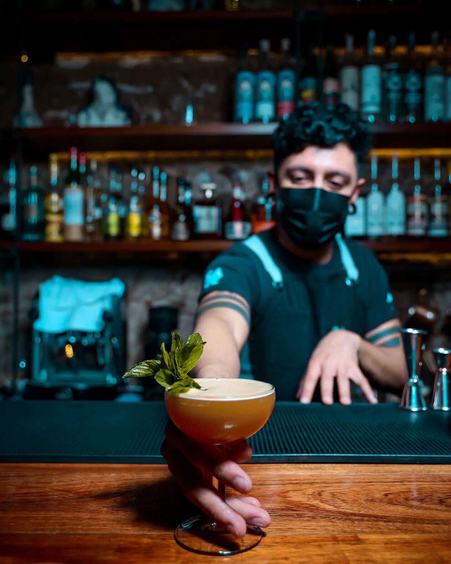 bartender holding drink