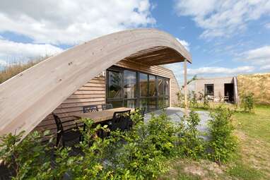 Utilitarian earth home on a farm in the Netherlands