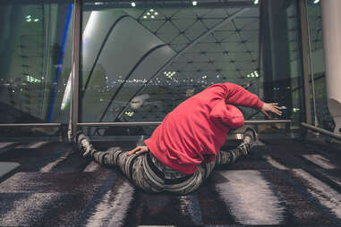 person stretching at airport