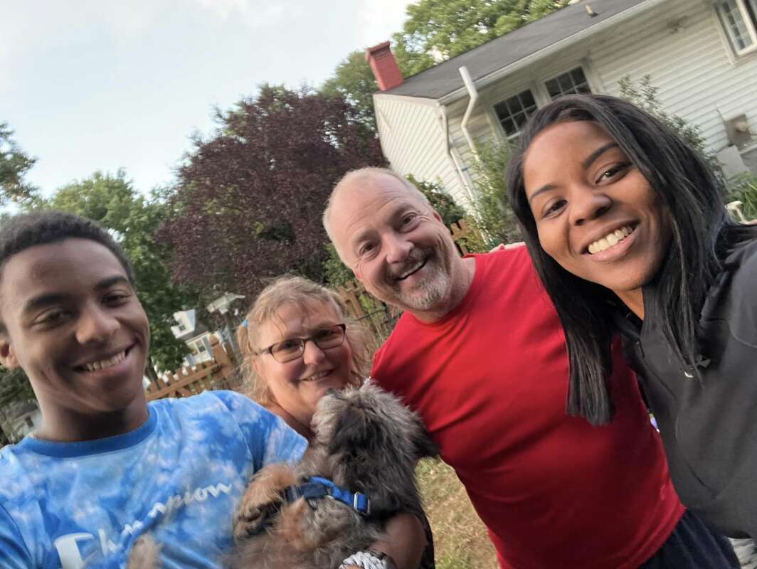people standing with dog